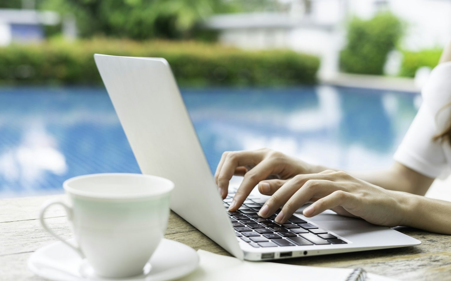 Hand close-up photo of an Asian female office worker Typing on the keyboard to send and receive emai