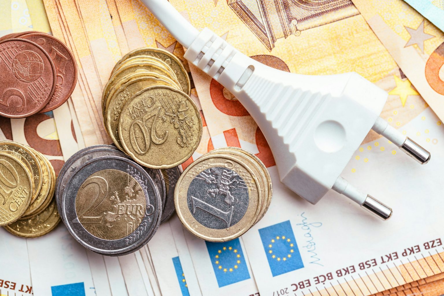 Energy savings concept with power plug and euro money