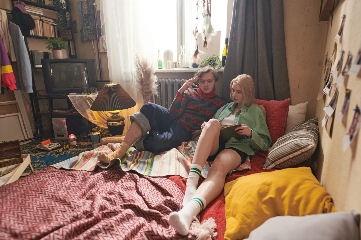 Young couple reading a book in the room